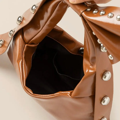 Ribbon Bow Grommeted Leather Hand Bag